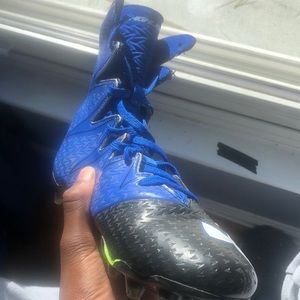 Highlight under armour football cleats; never worn.